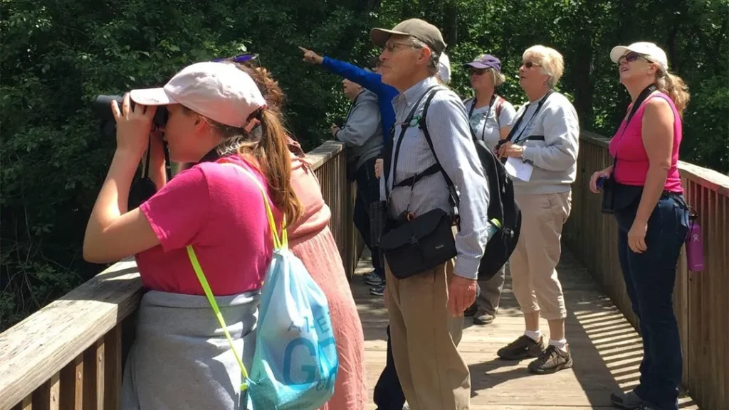 group looking through binoculars